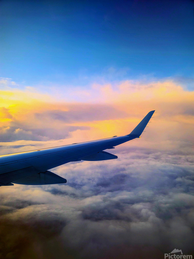 Above the Clouds: Flying into the Sunrise  Print